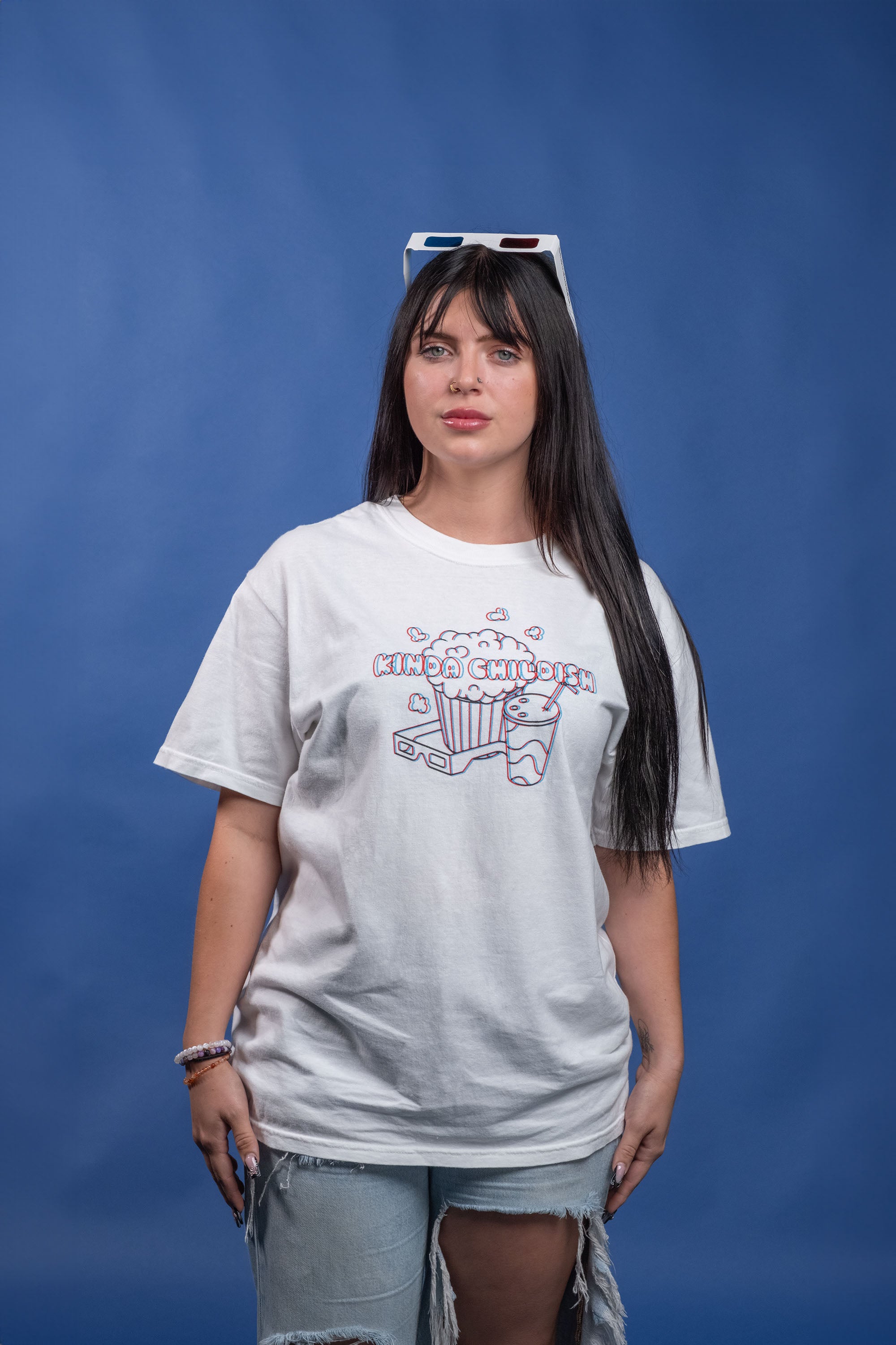 White cotton t-shirt with a 3D screen-printed movie theater design and a pair of 3D anaglyph glasses