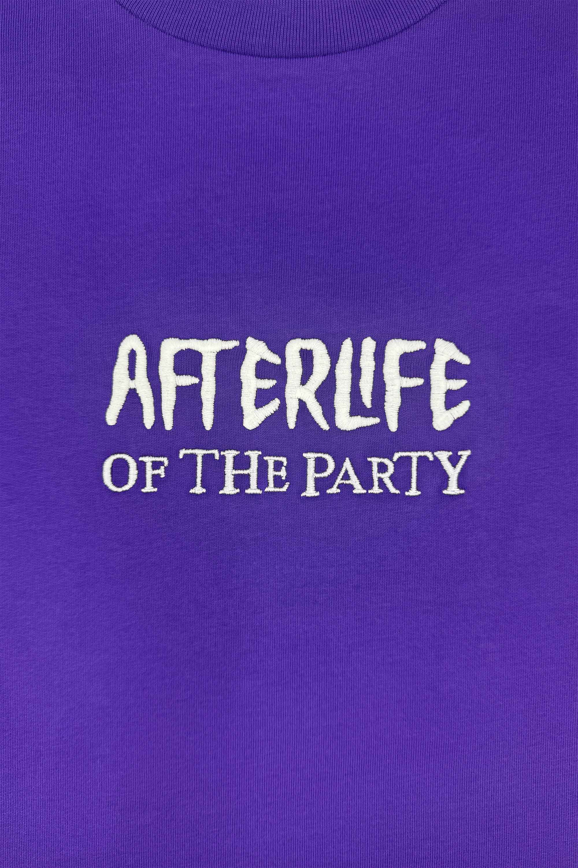 Purple preshrunk cotton t-shirt with glow-in-the-dark 'Afterlife' embroidery, printed graphic of tailgating skeletons