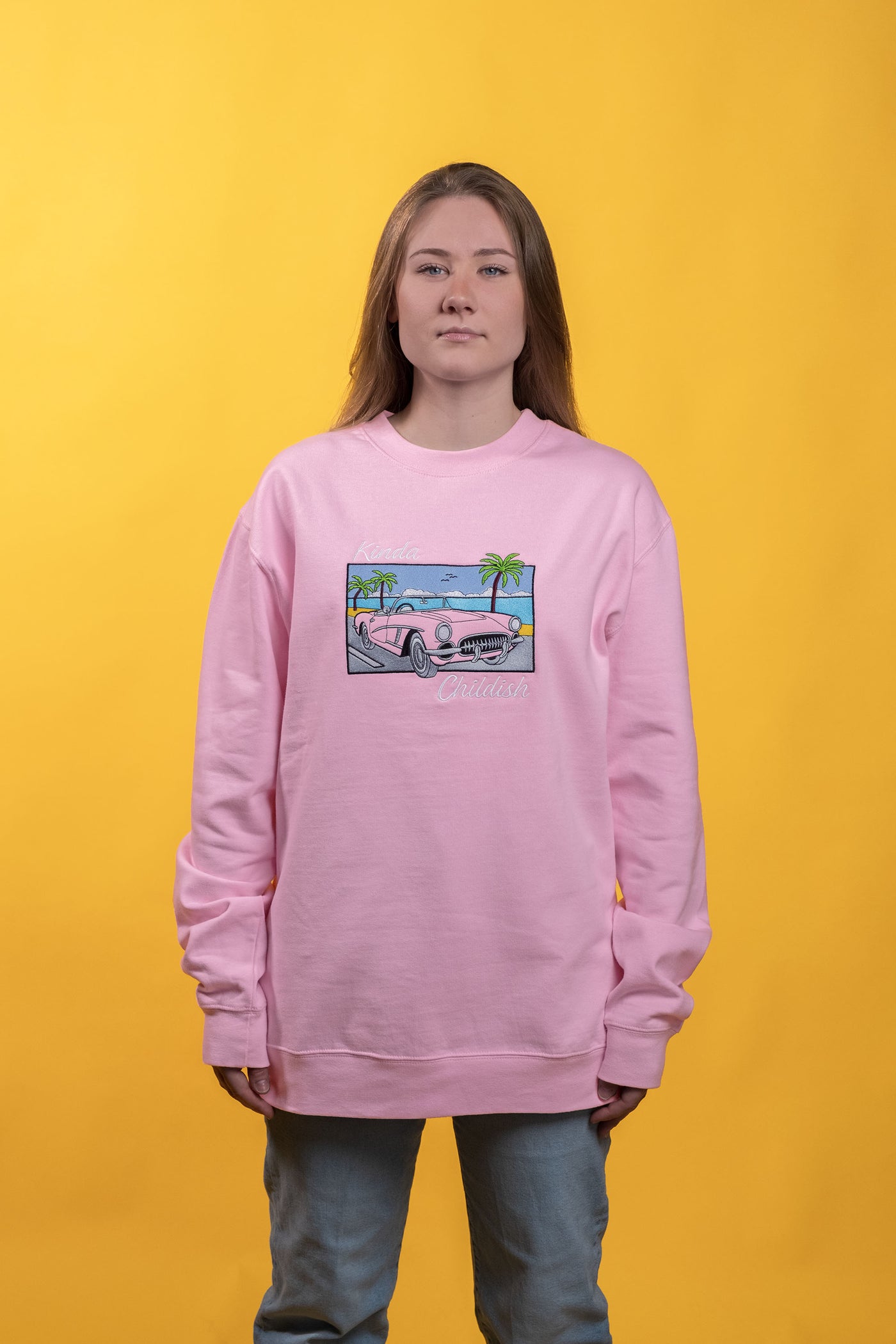 Pink cotton-polyester blend crewneck sweatshirt cozy brushed fleece interior embroidered classic car on a beach