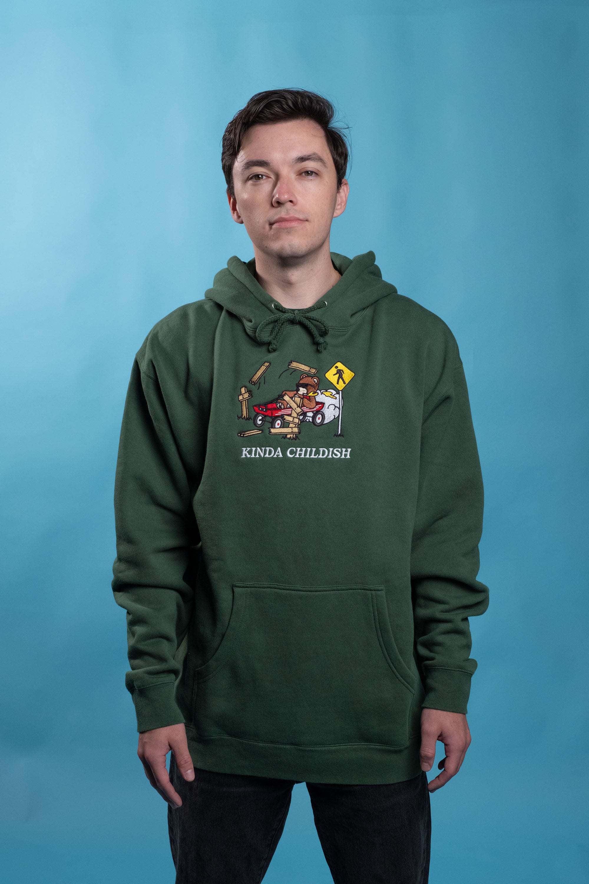 Green cotton-polyester blend hoodie with embroidered design of a drunk driving teddy bear